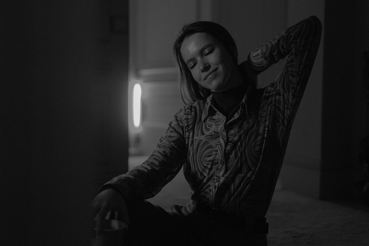 Mysterious Woman Relaxing in Living Room